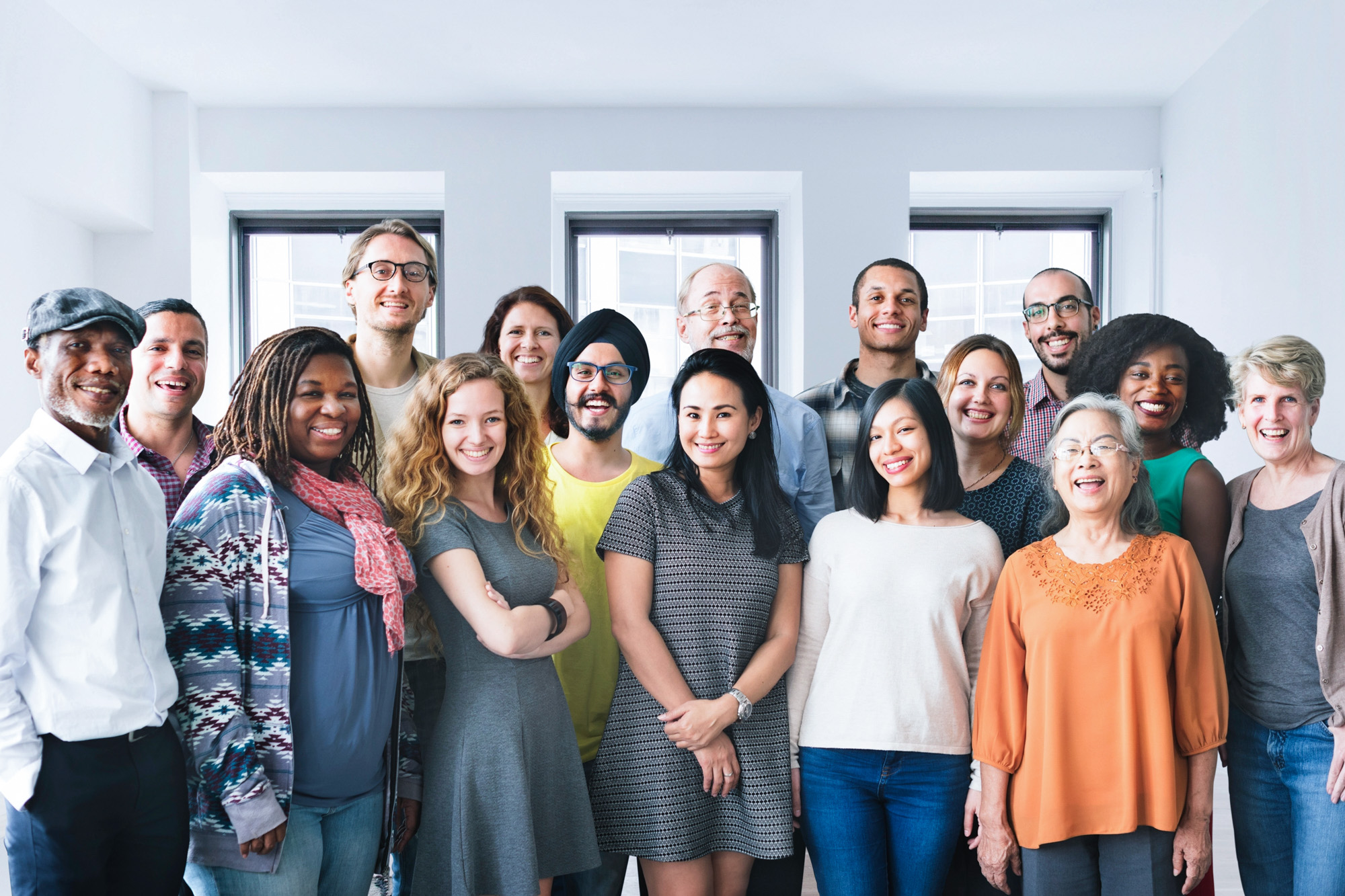 Smiling group of diverse clinical trial volunteers gathered by patient recruitment
